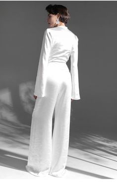 style: vogueWaist type: High waistPopular elements: zipperColor classification: whiteSleeve type: routineThe dress is long: Long style: deep V-collarMaterial composition: Polyester100% Elegant White Long Sleeve Jumpsuit, Chic Long Sleeve Jumpsuit For Wedding, Chic Long Sleeve Jumpsuits And Rompers For Wedding, White Long Sleeve Pantsuit For Party, White Long Sleeve Jumpsuits For Evening, White Long Sleeve Jumpsuits And Rompers For Evening, Long Sleeve Jumpsuits And Rompers For Summer Wedding, Elegant White Party Pantsuit, Elegant White Wide-leg Jumpsuit