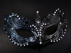 This captivating set includes two stunning masks, both designed in the classic Venetian style. The mask is adorned with sparkling rhinestones, reflecting the light and adding a touch of enchantment to her look while the black mask includes shimmer and exudes strength and sophistication, making him a charismatic presence at any masquerade or other special events.


Age Group/Gender - Adult/Unisex

Size/Type - One size fits all adults

Mask Color - Black
Mask Material - Metal women's, polyresin me Elegant Evening Eye Mask, Elegant Eye Mask For Party, Elegant Evening Mask For Carnival, Elegant Evening Masks For Carnival, Elegant Party Masks And Prosthetics, Elegant Black Masks And Prosthetics For Party, Elegant Black Party Masks And Prosthetics, Masquerade Rhinestone Eye Mask, Elegant Black Mask For Costume Party