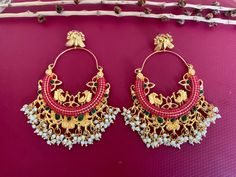 Gold Ruby CZ Kundan Chandbali Earrings. Light Weight Earrings. Height 4 inch Width 2 inch Handcrafted pair of earrings. Gives a traditional look. Can be worn for engagement and wedding parties. Indulge in it or gift it and watch the compliments flow! It is advisable to store jewelry in a zip lock pouch (air tight pouch), keep away from water perfume and other chemicals and clean it with soft cloth. FREE SHIPPING!! Kundan Chandbali, Pakistani Earrings, Water Perfume, Chandbali Earrings, Earrings Indian, Store Jewelry, Pakistani Jewelry, Indian Earrings, Wedding Parties