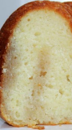 a close up of a piece of bread on a white surface with one slice missing