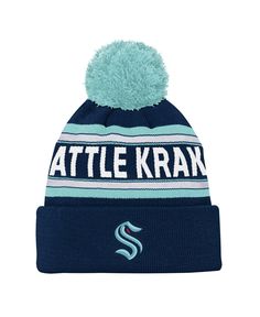 a blue and white knitted hat with the word attle kran on it