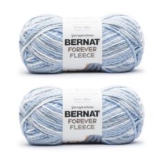 two skeins of bernat forever fleece yarn in light blue and white