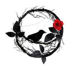 a red rose sitting on top of a black wreath