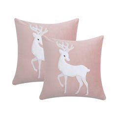 two pink pillows with white deer on them