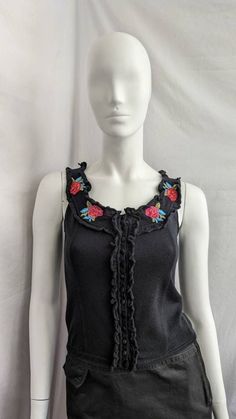 "Vintage knitted floral top from Blugirl by Blumarine. It fastens at the front with buttons. The top is decorated with ruffles along the edge. Size I40 D34 tag, fits like S-L (see the measurements) Condition 9/10 (the beads are missing in some places) Underarm to underarm - cm/\" Length from the back - cm/\" Sleeve length from throat   -cm/\" All measurements taken with garment lying flat. Vintage sizes vary greatly! We recommend comparing measurements with a similar style garment you own for be Fitted Sleeveless Knit Top With Ruffles, Fitted Sleeveless Ruffle Knit Top, Sleeveless Knit Top With Ruffles, Fitted Cotton Knit Top With Ruffles, Casual Fitted Floral Embroidery Tank Top, Fitted Floral Embroidery Tank Top, Fitted Casual Tank Top With Floral Embroidery, Fitted Tank Top With Floral Embroidery, Casual Fitted Tank Top With Floral Embroidery