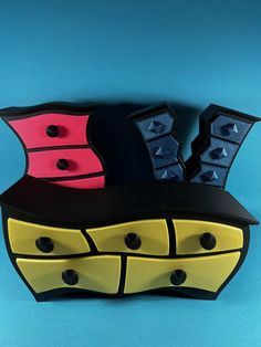 three pieces of furniture are stacked on top of each other, with black and yellow accents