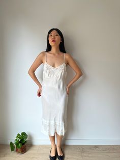 Vintage 1930s lace slip dress made of pure silk satin era: 1930 material: 100% silk  Size: Best fits up to M,small L, model wears S, 36 pit to pit:39cm waist:38cm Full length 112 cm condition: great antique condition Please keep in mind that this is almost 100 years old. It may have small marks and/or snags and sign of wear throughout. Please purchase willing to accept all signs of wear. NOTE For shop updates and extra info please follow me on Instagram: @shikivintage    *SHIPPING -We are shippi 1940’s Slip Dress, White Satin Dress, Vintage Pajamas, Liquid Satin, Lace Slip Dress, Clothing Vintage, Silk Slip Dress, Lace Slip, Silk Slip