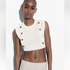 Rand New. Round Neck Cropped Top. Front Gold False Buttons Chic White Knit Top For Day Out, Cream Cropped Knit Top, White Cropped Knit Top, Chic White Ribbed Knit Top, Chic Beige Cropped Knit Top, White Cropped Casual Knit Top, White Cropped Fitted Knit Top, Chic White Crew Neck Crop Top, White Fitted Cropped Knit Top