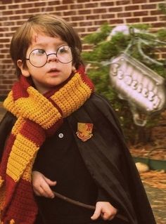 a young boy dressed in harry potter costume