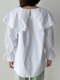 A 100% cotton blouse with wide collar at neckline with embroidered details, balloon puff sleeve and elastic cuff with ruffle look. Model is wearing MINUSEY ONE SIZE. Please allow 5-12 days shipping when in restocking. * MINUSEY ONE SIZE = EU 34-38, US 2-6* 100% Cotton* Dry clean* Made in Korea- Model Height: 173cm/5'8" (US4, EU36) Cotton Blouse With Smocked Bishop Sleeves, Long Sleeve Puff Sleeve Top With Ruffles For Daywear, Cotton Lantern Sleeve Blouse With Smocked Cuffs, Cotton Blouse With Smocked Cuffs And Lantern Sleeves, Cotton Blouse With Smocked Lantern Sleeves, Cotton Tops With Detachable Collar And Long Sleeves, Cotton Puff Sleeve Top With Lace Collar, Spring Cotton Blouse With Detachable Collar, Cotton Top With Lace Collar And Puff Sleeves