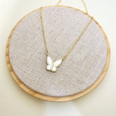 This beautiful mother of pearl and gold plated Butterfly pendant necklace is a perfect piece to incorporate gold into your everyday, casual style. Our quality hand-crafted bar necklaces are handmade with love and care and one at a time. ENTER OUR SHOP HERE for more beautiful jewelry : https://www.etsy.com/shop/MillyStreet Thank you for shopping with Milly Street! PLEASE READ OUR POLICIES https://www.etsy.com/shop/MillyStreet?ref=l2-shopheader-name#policies PLEASE READ OUR PRODUT CARE https://www Dainty Adjustable Gold Butterfly Necklace, White Delicate Chain Charm Necklace As A Gift, White Charm Necklace With Delicate Chain For Gift, White Dainty Everyday Necklace, Trendy White Necklace With Adjustable Chain, White Gold Plated Charm Necklace With Adjustable Chain, White Gold-plated Charm Necklace With Adjustable Chain, Gold Charm Necklaces For Mom, White Charm Necklaces For Mother's Day Gift