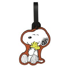 Travel in style with the Peanuts Unisex Snoopy PVC Luggage Tag, featuring everyones favorite beagle, Snoopy! Made from durable PVC material, this fun and functional luggage tag helps you easily identify your bags while adding a touch of whimsy to your travels. The sturdy design and adjustable strap ensure that your tag stays securely attached, while the back features a card slot for your contact information. Perfect for Peanuts fans of all ages, this tag is a must-have travel accessory. Size: M. Must Have Travel Accessories, Travel Tags, The Peanuts, Securely Attached, Travel In Style, Snoopy And Woodstock, Peanuts Snoopy, Luggage Accessories, Pvc Material