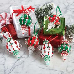 christmas ornaments and presents on a marble surface