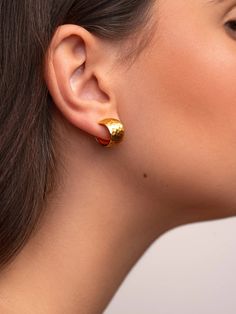 Elevate your style with our Gold Textured Hoop Earrings. Made from 100% real gold, these earrings boast a unique textured design for a timeless yet modern look. Perfect for any occasion, these earrings will add a touch of elegance and sophistication to any outfit.