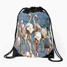 a drawsack bag with flamingos standing in the water