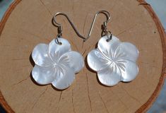 These beautiful earrings feature a carved White mother of pearl shell flower . The iridescence of the Mother of Pearl Shell is really amazing. Depending on the light source they will radiate colors varying from whites to creamy whites. The shells are then polished to a high gloss to reveal the beauty of their natural pattern. Enjoy these lightweight beauties that are so easy to wear. these beach earrings are perfect for everyday and any occasion. DETAILS - Shell types :White Mother of Pearl Shel Mother Of Pearl Flower Jewelry For Anniversary, Anniversary Jewelry In Flower Shape With Mother Of Pearl, Anniversary Jewelry Mother Of Pearl Flower Shape, Anniversary Flower Shaped Mother Of Pearl Jewelry, White Mother Of Pearl Flower Shaped Jewelry, White Mother Of Pearl Jewelry In Flower Shape, White Flower-shaped Mother Of Pearl Jewelry, White Mother Of Pearl Flower Jewelry, Flower Shaped Mother Of Pearl Jewelry For Anniversary