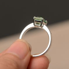 This is a gorgeous handmade creation. Its beauty is its simplicity & Elegance. The 6*8mm emerald cut green sapphire is crafted in solid sterling silver / 14k gold. It is available to customized, if you have any mind, just let me know, we will discuss with it. All item is sent in a beautiful gift box You can realize more lovely stuff clicking the link https://www.etsy.com/shop/knightjewelry?refshopsection_shophome_leftnav Please leave the correct address and you PHONE NUMBER for delivering su Green Sapphire Ring For May Birthstone In Sterling Silver, Green Sapphire Sterling Silver Ring For Wedding, Green Brilliant Cut Emerald Ring In Sterling Silver, Green Diamond-cut Sterling Silver Jewelry, Green Sapphire Ring Sterling Silver, May Birthstone, Emerald Cut Sapphire Ring, Silver Wedding Ring, Green Gemstone Ring, Green Sapphire Ring