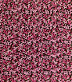 pink and black flowers are in the middle of a flowery pattern on a dark background