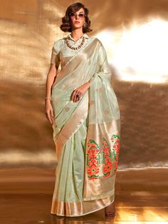 Many popular designers have chosen the pista green color tissue silk saree with zari weaving work to bring elegance and glamour to the forefront of fashion.
This gorgeous pista green zari weaving silk event wear saree with blouse is a stunning addition to any wardrobe, perfect for weddings, festivals, and other special occasions.
Measuring 5.50 meters, the saree provides ample fabric for graceful draping, complemented by unstitched blouse material for personalized customization.
The gorgeous pis Tissue Fabric, Grey Saree, Pista Green, Purple Saree, Sea Green Color, Party Sarees, Tissue Saree, Indian Wedding Wear, Wear Saree