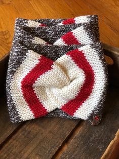 a crocheted hat sitting on top of a wooden table