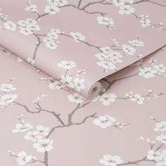 a pink wallpaper with white flowers on it