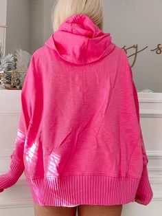 The Lana Pullover from Sassy Shortcake is a hot pink pullover. She has an oversized fit. She features thumb holes, a button up front, and a hood. Model wearing a size small. Lined. Pink Oversized Long Sleeve Hoodie, Oversized Pink Outerwear With Ribbed Cuffs, Pink Cozy Hoodie With Ribbed Cuffs, Pink Hooded Sweater With Ribbed Cuffs, Cozy Pink Hoodie With Ribbed Cuffs, Cozy Pink Outerwear With Ribbed Cuffs, Oversized Pink Tops With Drawstring Hood, Pink Loungewear Outerwear With Ribbed Cuffs, Pink Outerwear With Ribbed Cuffs For Loungewear