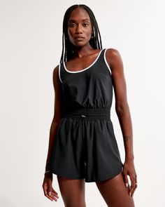 Versatile 3.75 inch (9.5 cm) romper in our signature Traveler fabric, with adjustable wide straps, elastic waist with tie detail, scoop neckline and pockets. Utility Romper, Adventurous Women, Summer Attire, Black Romper, Linen Women, Female Travel, Wide Straps, Rompers Women, American Apparel