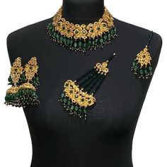 Green bridal jewellery set. Set includes-   Earrings  Tikka Necklace  Jhumar Elegant Chandbalis For Eid Ceremonies, Green Kundan Bridal Earrings Hand Set, Hand Set Green Kundan Bridal Earrings, Green Kundan Necklace With Meenakari Detail, Green Kundan Necklace With Meenakari In Gold Plated, Green Kundan Chandbali Jewelry, Elegant Ceremonial Jhumkas With Stone Work, Elegant Meenakari Bridal Sets For Eid, Elegant Green Lehenga With Stone Work