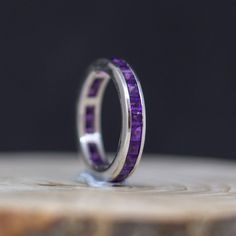 2.5 MM Full Eternity Stackable Stacking Square Simulated Purple Amethyst Band Ring, Silver Band Ring, Wedding Band Ring, Valentine's Day gift, Feather Gemstone Ring, Color Gemstone Rings, Valentine's Day Gift, Vintage Ring, Anniversary Ring, Personalize gift, Proposal Ring, Engagement Ring, Wedding Ring, ❤ Item Details: Metal: Sterling Silver Metal Purity: 925 Setting: Channel Setting Center Stone: Amethyst Center Stone Shape: Square Stone Weight: 2.42 Carat Gross Weight: 3.340 Gram Stone Size: Gift Sapphire Ring Channel Set In Sterling Silver, Sterling Silver Eternity Band With Gemstone For Gift, Channel Set Round Band Jewelry For Gifts, Channel Set Round Band Jewelry Gift, Sterling Silver Gemstone Eternity Band, Sterling Silver Eternity Band With Gemstone, Gift Channel Set Round Band Jewelry, Silver Eternity Band With Accent Stones For Anniversary, Gift Sapphire Ring Channel Set