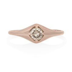 Our favorite new signet styled ring features a sparkling honey-champagne diamond set front and center. A round brilliant cut, this diamond offers all the fire of a classic white diamond but in a more subtle, warm hue. Great worn as a pinky ring or a full size ring! Approximately 0.28 carat. Set in 14K yellow, white or rose gold. Also available with a salt & pepper or white diamond upon request. Please contact us for customizations. Please contact us regarding expedited shipping times & rates in Heirloom Rose Gold Diamond Ring With Single Diamond, Dome Ring With Rose Cut Round Diamonds, Dome Ring With Round-cut Rose Diamonds, Rose Gold Signet Ring With Single Diamond, Rose Gold Diamond Signet Ring With Single Diamond, Rose Gold Diamond Birthstone Ring With Round Cut, Rose Gold Diamond Birthstone Ring With Single Diamond, Wedding Dome Ring With Single Round Cut Diamond, Classic Rose Gold Diamond Signet Ring