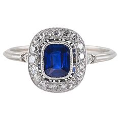 Charming Art Deco Style Platinum marked exquisite halo design is the epitome of eternal elegance Centrally set with a vibrant velvety Blue hue oval cushion cut natural Sapphire estimate .77 Ct. (5.9 x 4.9 mm.) weight of the Sapphire is stamped into the shank Surrounding mill pointed Halo of Diamonds for .55 CT G VVS/VS little enhancement of Diamonds on shoulders too adding extra detail to this gorgeous and pretty ring Fine condition all through, can be re-sized Further Details Below Metal: platinum Hallmarks: assay and sapphire weight Gems: 1 oval cushion cut natural unheated blue sapphire of .77 Ct (5.9 x 4.9 mm.) – 19 old brilliant cut diamonds totalling approx .55 Ct (G-VVS/VS) UK size: N 1/4 US size: 6.75 Measures: head is 11 x 10 mm. (h. x w.) Weight: 2.9 grams Condition: very good co Pretty Ring, Halo Design, Platinum Diamond Rings, Platinum Ring, Pretty Rings, Natural Sapphire, Art Deco Style, Cluster Ring, Blue Hues