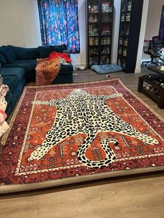 a living room filled with furniture and a large rug