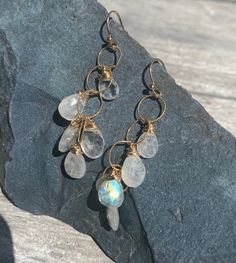 "These are one of my favorite styles. The beautiful rainbow moonstones (white moonstones with flashes of color) just glows. They are faceted for extra light reflection. Five teardrop stones of different sizes on each ear cascade down vermeil rings. About 2\" long.  These are shown on simple vermeil ear wires but if you prefer locking vermeil ear wires that is an option for extra safety.  Also, there is an option to have these done in sterling silver.  You will be so happy with these beauties!" Waterfall Earrings, Bainbridge Island, White Moonstone, Beautiful Rainbow, Light Reflection, Moon Stone, Rainbow Moonstone, Earrings Gold, Ear Wires