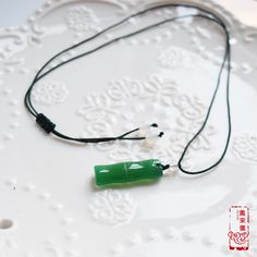 Decorated with natural jade stone charms, this collection of necklaces expresses Chinese typical themes under the background of jade culture. We select a series of carved jade stone pendants: lotus, baby lock, bamboo, and peace buckle. Jade is a symbol of the virtue of gentlemen and highly prized for its strength and beauty. It will bring people good fortune and soft elegance. The paired necklace is adjustable with braided craft, made of top-quality jade cords. The overall design embodies implic Chinese Jade Necklace, Jade Pendant Necklace, Chinese Jade, Carved Jade, Baby Lock, Jade Necklace, Jade Carving, Green Agate, Natural Jade