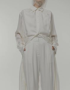 This shirt dress is made of cupro with a beautiful soft texture to the touch. The loose fit is decorated with pleat details at the collar, waist and back and has elegant, elongated cuffs. By buttoning-up the side button at the left side of the waist it can easily transform to a wrap dress style with a slim waistline. Pair it with wide-leg pants to achieve a relaxed chic look.Model’s Measurements: Height: 173cm, Bust: 79cm, Waist: 61cm, Hip: 89cm.Model is wearing a size XS.XXS Bust: 114cm, Length Relaxed Chic, Wrap Dress Styles, Maxi Shirts, Wide Leg Pants, Duster Coat, Wrap Dress, Wide Leg, Loose Fitting, Shirt Dress