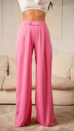 Make a statement in these pink asymmetrical high-waisted trouser pants. These modern-style dress pants feature an asymmetrical cut for a unique look. Crafted from high quality material, these pants are designed to offer both comfort and style. Elevate any outfit with these distinctive trousers. Fabric & fit: 96% POLYESTER 4% SPANDEX Model is wearing size Small. Pink Solid Color Bottoms For Loungewear, Pink Solid Color Loungewear Bottoms, Pink Long Pants With Solid Color, Stretch Pink Bottoms Solid Color, Pink Wide Leg Pants For Loungewear, Pink Wide Leg Loungewear Pants, Pink Stretch Pants Solid Color, Stretch Pink Pants, Stretch Pink Solid Color Pants