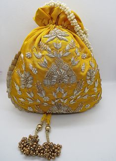 Festive Floral Embroidered Potli Bag, Festive Floral Embroidery Potli Bag, Festive Bags With Resham Embroidery For Festivals, Traditional Potli Bag With Resham Embroidery For Festivals, Traditional Resham Embroidery Potli Bag For Festivals, Traditional Resham Embroidery Potli Bag For Festive Season, Traditional Potli Bag With Floral Embroidery For Festive Occasions, Traditional Floral Embroidered Potli Bag For Festive Occasions, Festive Gold Embroidery Potli Bag