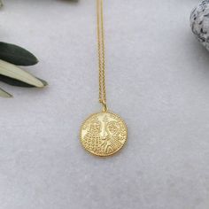 A nice 14k gold-filled necklace with an eye-catching Christian Pendant. A dainty everyday charm that brings good luck and protects the person that is wearing it. A nice gift for her Length approx. 16 inches / 40.5 ♥ All items will be delivered in a nice gift envelope to minimize shipping expenses for you! You may choose gift wrapping at checkout if you wish! If you need it sooner, select expedited shipping at checkout and leave us a note with the wishing date! ★ Read our policies before purchase Gold Plated Spiritual Medallion Charm Necklaces, Spiritual Gold Plated Medallion Charm Necklaces, Spiritual Gold Plated Medallion Charm Necklace, Good Luck Medallion Necklace With Coin Pendant, Symbolic Good Luck Coin Pendant Necklace, Handmade Yellow Gold Round Pendant Medallion Necklace, Handmade Yellow Gold Medallion Necklace With Round Pendant, Symbolic Coin-shaped Brass Necklaces, Symbolic Gold-plated Medallion Necklace