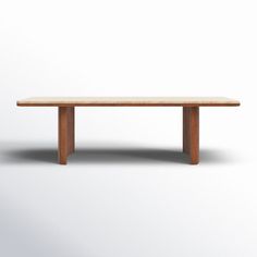 a wooden table sitting on top of a white floor