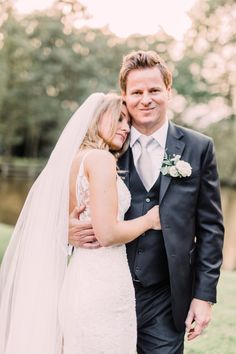 a bride and groom pose for a wedding photo