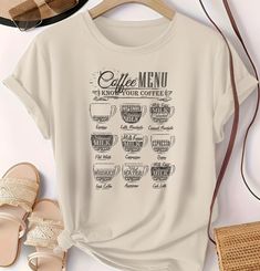 a white t - shirt with coffee menu on it