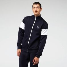 Sergio Tacchini Navy Sweatshirt New With Tags Size M Zipped In Front Has Two Pockets On Zipper 54% Polyester 46% Cotton Navy Long Sleeve Track Jacket With Ribbed Cuffs, Casual Navy Cotton Tracksuit, Navy Cotton Casual Tracksuit, Navy Casual Cotton Tracksuit, Cotton Athleisure Track Jacket With Zipper, Navy Cotton Track Jacket For Sports, Navy Athleisure Track Jacket With Long Sleeves, Sporty Long Sleeve Navy Track Jacket, Fitted Casual Cotton Track Jacket