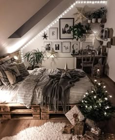 an attic bedroom decorated for christmas with lights on the ceiling and pictures above the bed