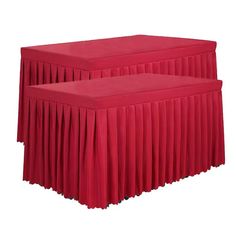 two red bedspreads with pleated skirting on the top and bottom, sitting next to each other