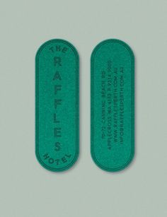 two green tags with the words raffles on them