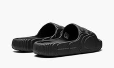 The adidas Adilette 22 “Black” is a monochromatic black colorway of the comfortable slip-on sandal that’s constructed from environmentally-friendly materials.  Reminiscent of Kanye West’s adidas Yeezy Slide, the Adilette 22 features a futuristic design with wavy lines inspired by 3D topography.  The body is made from lightweight EVA foam that contains up to 25% plant-based ingredients derived from sugarcane.  As for its appearance the “Black” is finished with a monochromatic black design.  “The Adidas Adilette 22, Adidas Yeezy Slide, Adidas Sandals, Yeezy Slides, Adidas Shoes Mens, Pretty Shoes Sneakers, Adidas Adilette, Wavy Lines, Adidas Trefoil