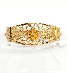 10 karat Yellow Gold Vintage Filigree Flower Bracelet, 7.5" length REAL SOLID GOLD, NOT PLATED OR FILLED; ACID TESTED 10KT Please note, vintage pieces may have slight imperfections due to handling over extended time. Any significant flaws will be disclosed. Yellow Gold Filigree Bracelet For Formal Occasions, Heirloom Yellow Gold Bracelet With Filigree, Heirloom Yellow Gold Filigree Bracelet, Formal Yellow Gold Bracelet With Filigree, Formal Yellow Gold Filigree Bracelet, Luxury Filigree Round Bracelets, Elegant Round Gold Filigree Bracelet, Elegant Gold Filigree Bracelet, Ornate Yellow Gold Bracelets With Intricate Design