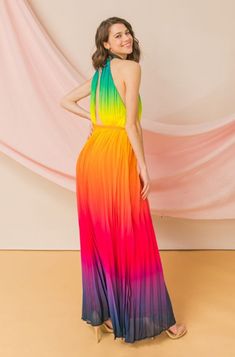 A semi-sheer pleated maxi dress featuring a vibrant ombré multicolored wash, high banded neckline, elasticized waist, open back, back button loop closure, removable self-tie sash, woven lining, and a flowy silhouette. Details - Self: 100% polyester Lining: 100% polyester - Imported Size & Fit - Model is 5`9" and wearing size Small SIZE CHART Measurements are in inches Size Chest Waist Hips Length S 34 26-28 36-38 56 M 36 28-30 38-40 56 L 38 30-32 40-42 56 Please take note of the size measurement Free Wedding Dress Patterns, Rainbow Dress Up, Rainbow Dress Girl, 2014 Vibes, Crochet Wedding Dress Pattern, Cocktail Dress Code, Crochet Wedding Dresses, Rainbow Skirt, Wedding Dress Patterns