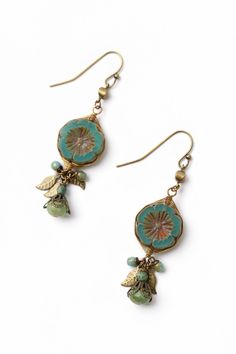 These handcrafted earrings are longer in design with a stunning Czech glass flower focal that has been hand wrapped in our signature herringbone weave with antique brass leaves and dangles of Czech glass. They are completed with antique brass ear wires and hang at approximately 2.5" in length. Antique Brass (lead and nickel free) Czech Glass 2.5", with antique brass ear wires We hand select our natural materials, thus there may be slight variations in color and/or size that will not detract from Herringbone Earrings, Antique Style Jewelry, Silver Gold Necklace, Czech Glass Jewelry, Diy Jewelry Earrings, Designer Handmade Jewellery, Glass Beads Jewelry, Unique Jewelry Designs, Handcrafted Earrings