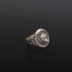 Unleash your wild spirit with our beautifully crafted Wolf Ring. This sterling silver ring manifests the untamed spirit of the wolf, a perfect piece for lovers of nature and the wilderness. This unique ring will surely appeal if you view the wolf as a totem or admire its wild spirit. Perfect as an everyday statement piece or a gift for that outdoor lover in your life. Let your inner wolf howl with this edgy-style accessory. ✦ Jewelry Specifications ✦ * Weight: 13-14 grams * Finishes: Oxidized, Polished, Gold, Rose Gold * Material: 925 Sterling Silver * Hallmark: 925 * Customization: 8K, 10K, 14K, and 18K white/rose/yellow gold options available upon request. Contact me! ✦ Shipping Details ✦ * Standard Shipping * Processing: 2-4 business days * Delivery: 2-5 business days * Remember to incl Wolf Promise Ring, Silver Wolf Design Ring As Gift, Wolf Design Ring Jewelry For Gift, Wolf Design Ring Jewelry Gift, Silver Ring With Wolf Design, Wolf Howl, Wolf Totem, Wolf Ring, Jewelry Nature